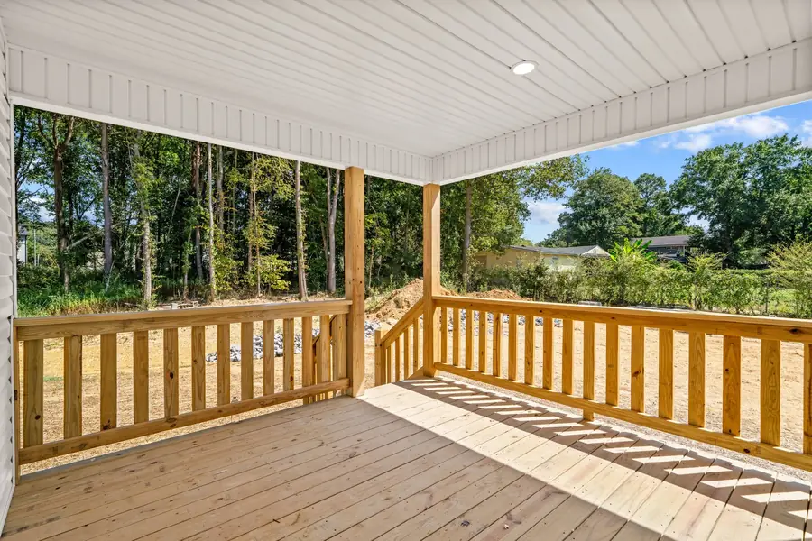New covered wooden deck with railings