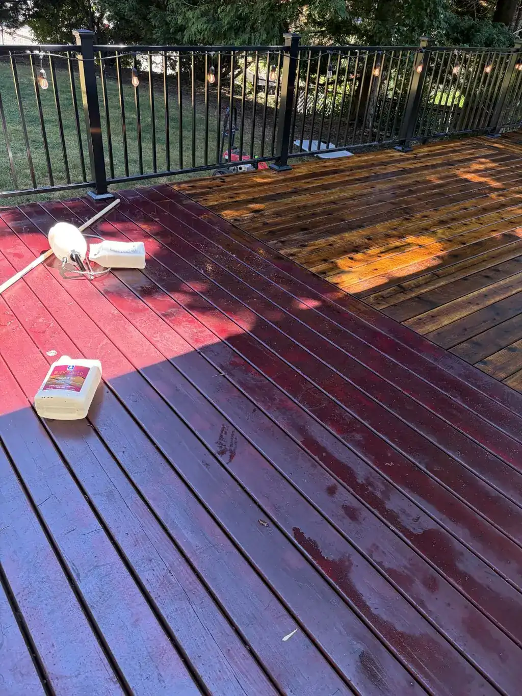Wood deck partway through staining