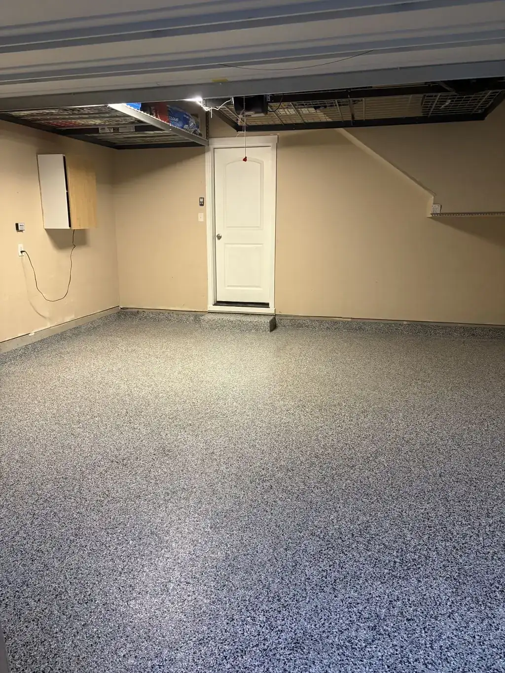 Garage floor with a gray flake epoxy coating